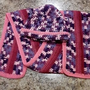 A crocheted hat and scarf set